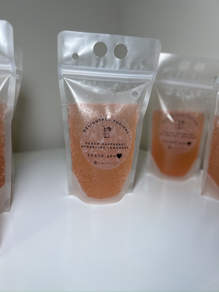 A sparkling Peach Raspberry Lemonade pouch, fizzy and blush-pink