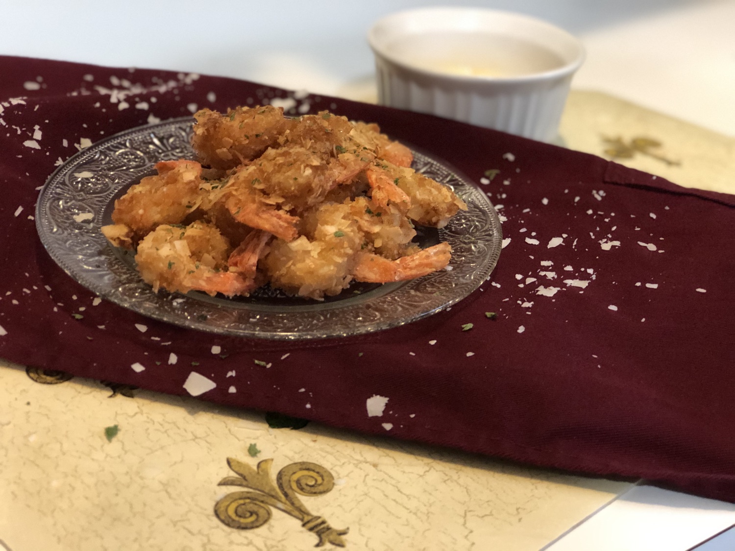 Crispy battered shrimp tempura plated with a dipping sauce